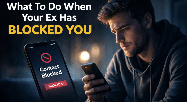 Man staring at phone after ex blocks him, illustrating breakup advice on what to do when your ex has blocked you.