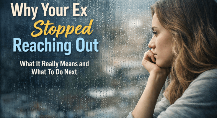 A thoughtful young woman looking out a rainy window after a breakup.